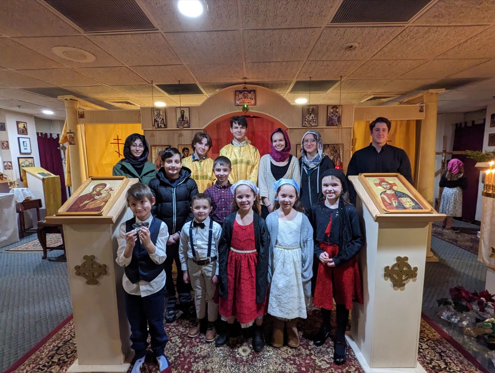 The clergy and servers of the parish gathered before the iconostasis
